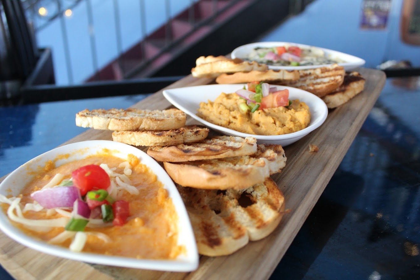 Shareable appetizer with bread and dips